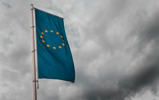 Flag of the European Union illustrating the looming EU AI Act, a framework that places stringent regulations on how businesses can integrate artificial intelligence.