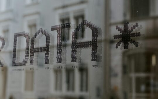 Window with "data" written on it for an article on how poor data structures and legacy systems are hindering the potential of AI to transform public services.