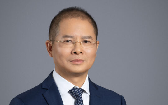 Article illustration of Eric Xu of Huawei. Article concerns new Ascend chip range from the company.