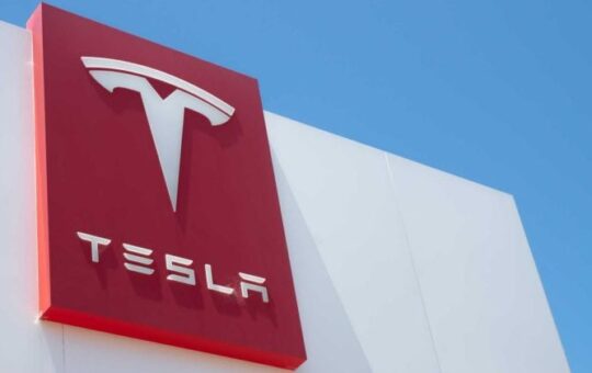 Tesla shares reach near one-year high, up 4.1%