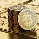 Picture of bitcoins sitting on top of a stack of gold bricks
