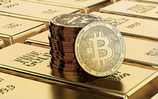 Picture of bitcoins sitting on top of a stack of gold bricks