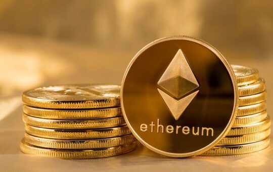 Picture of ethereum coins staked together with one coin stood next to them